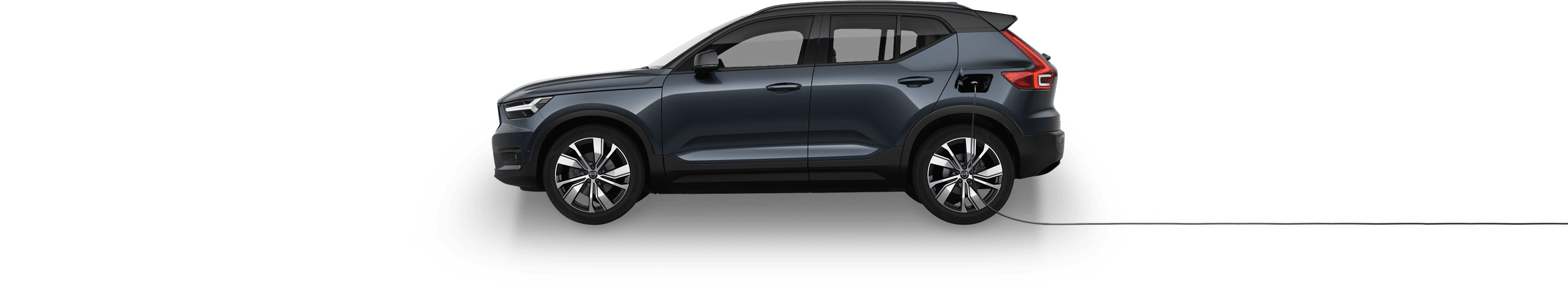 Volvo XC40 Recharge from the side with charger attached.